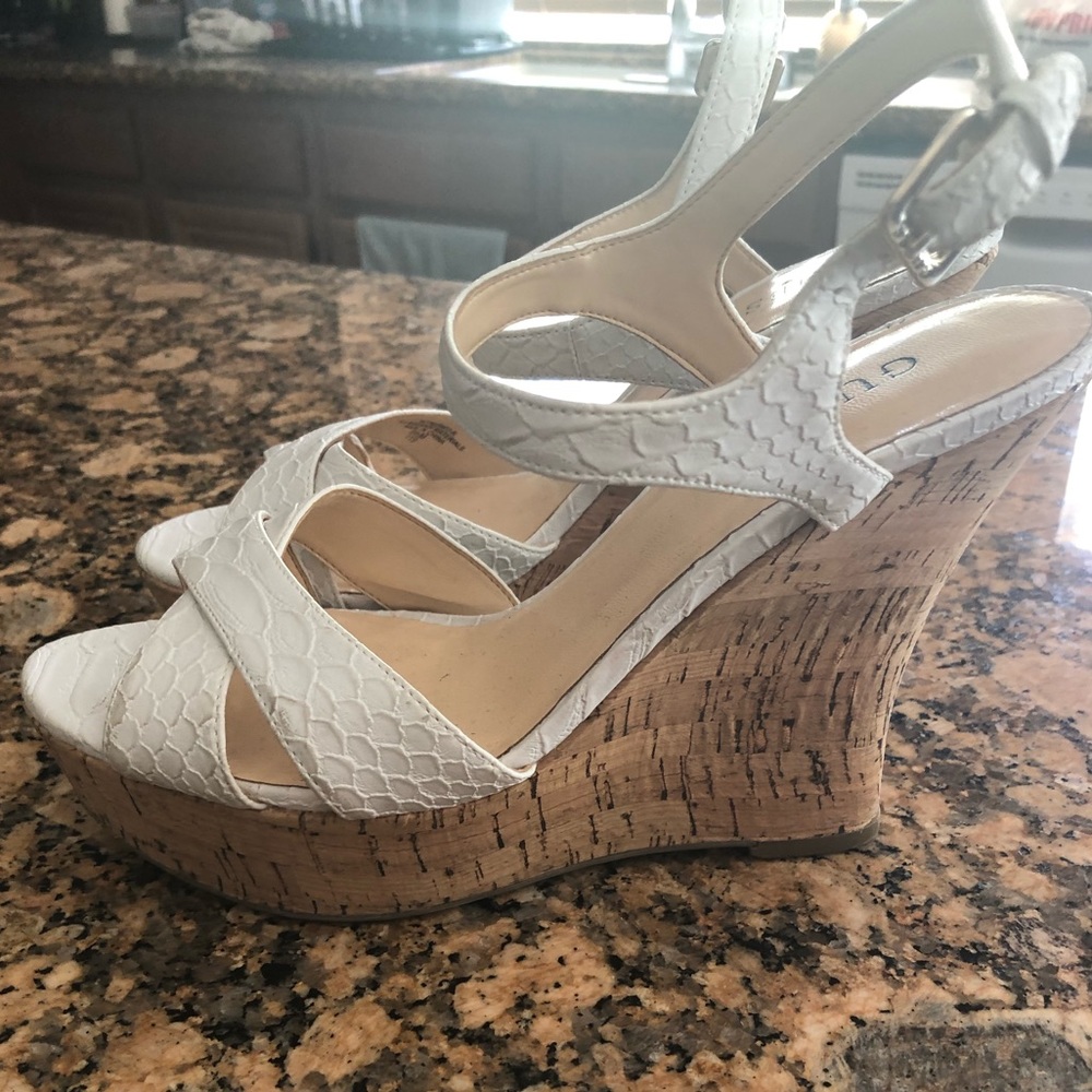 Guess white wedge heel sandals.